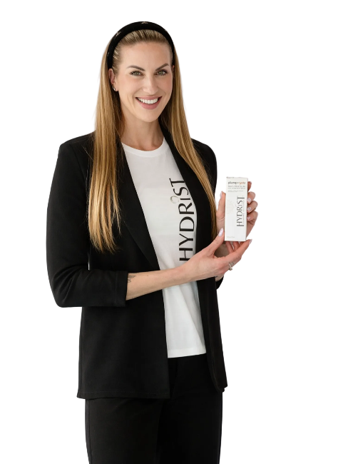 Lindsay wearing a HYDRIST t-shirt and blazer, holding HYDRIST Plump Multi-Molecular Hyaluronic Serum with Gotu Kola — Real People, Real Skin