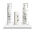 HYDRIST Starter Bundle with Recover Mist, Plump Serum, and Nourish Balm on a platform on a white background