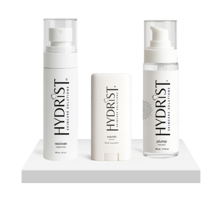 HYDRIST Starter Bundle with Recover Mist, Plump Serum, and Nourish Balm on a platform on a white background